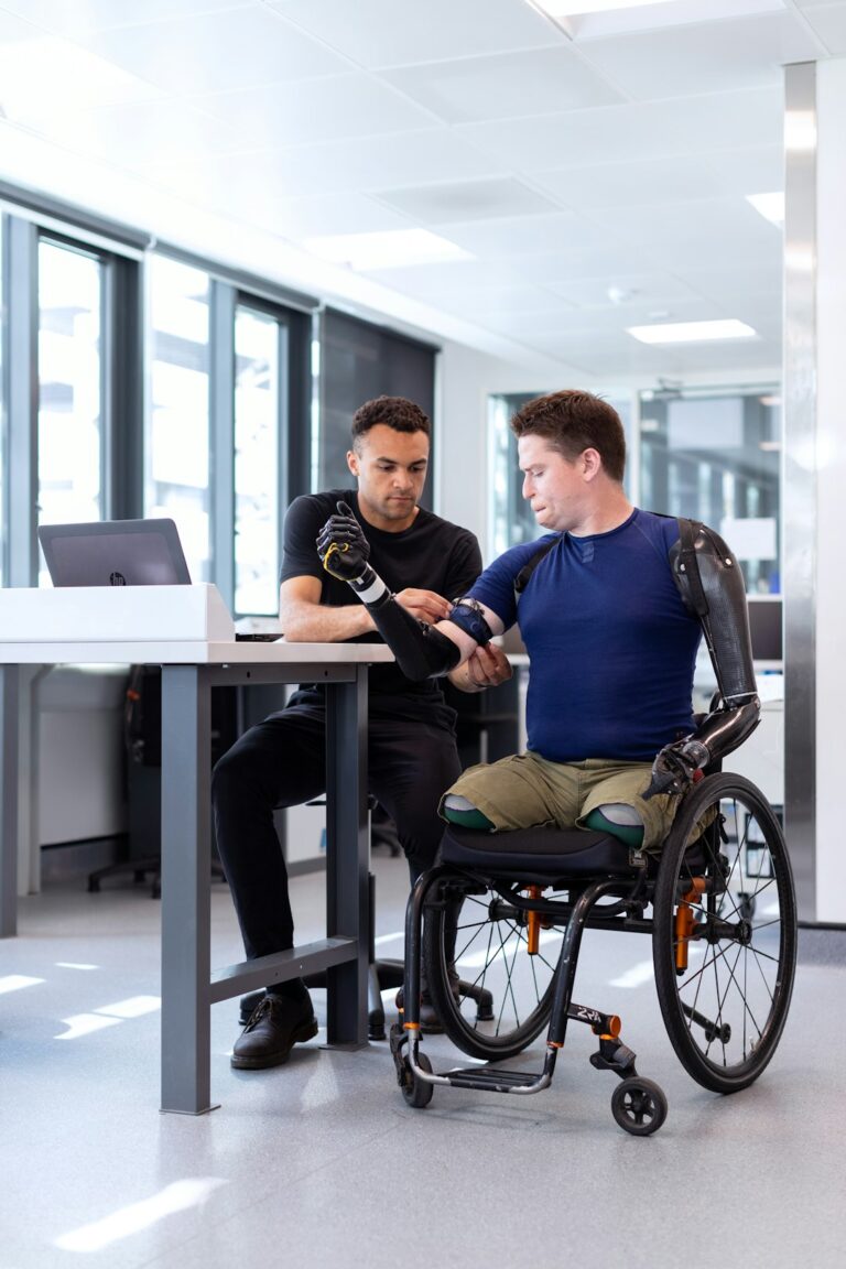 Employee reviews disability insurance documents and pay records at a kitchen table.
